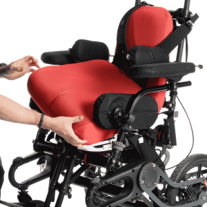 Seating specialist fitting seat cushions onto a wheelchair